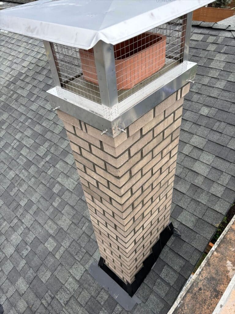 Finished chimney rebuild in Laurelhurst, Oregon, with stainless cap.